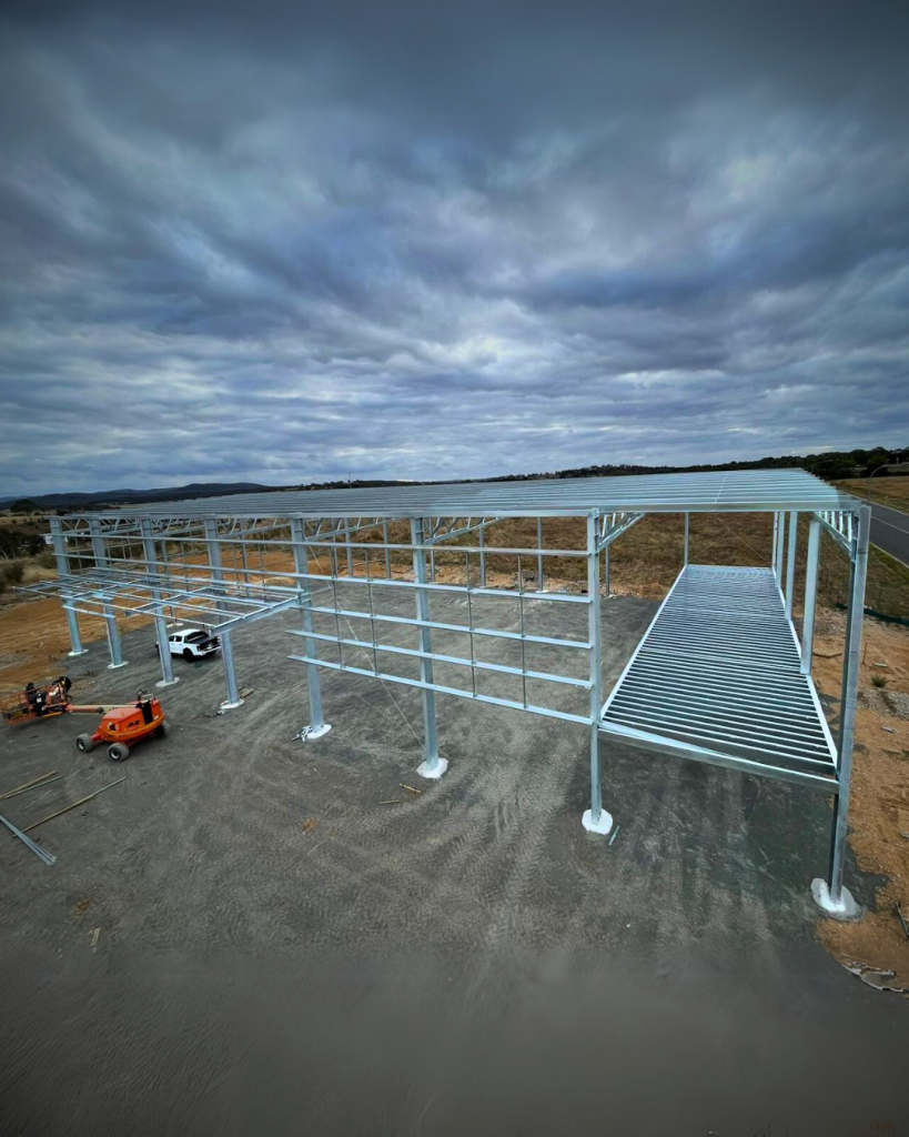 Industrial rigging in progress at Goulburn Gecko Shed, lifting steel framework for a commercial warehouse.