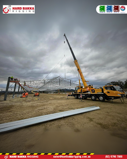 Hard Bakka Rigging using a mobile crane to erect the steel framework for an equestrian exhibit structure at the Techspan project in Kootingal.