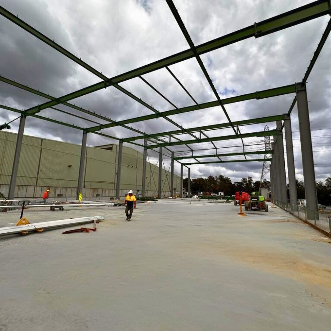 Structural steel framework installation for the Sydney Markets fruit storage warehouse, highlighting the benefits of onsite steelwork in industrial construction.