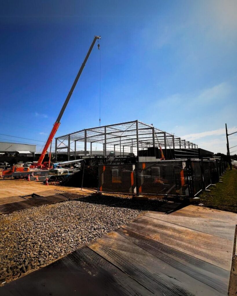 Steel rigging installation in progress using a crane at B&G LOGOs warehouse project site in Prestons, 2024