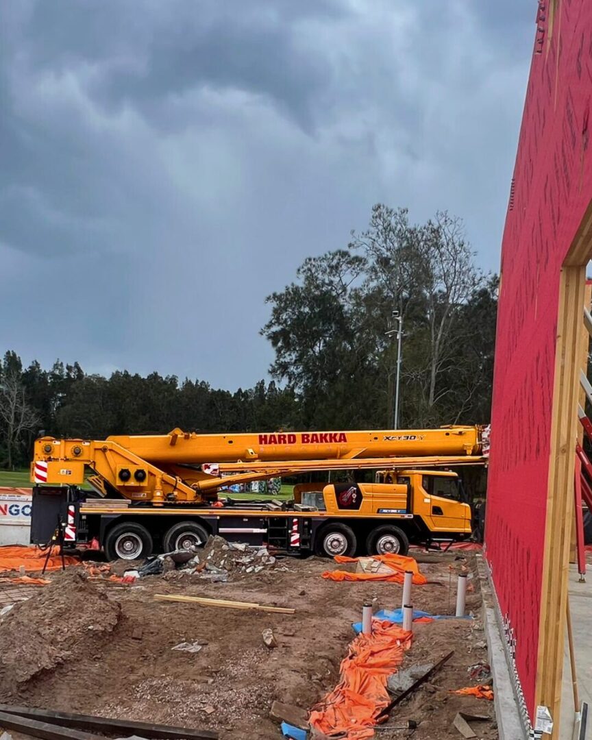 Mobile crane from Hard Bakka Rigging positioned at a construction site in Warriewood for steel installation.