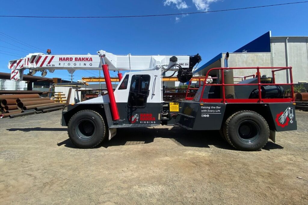 Hard Bakka Rigging Franna crane parked at an industrial facility