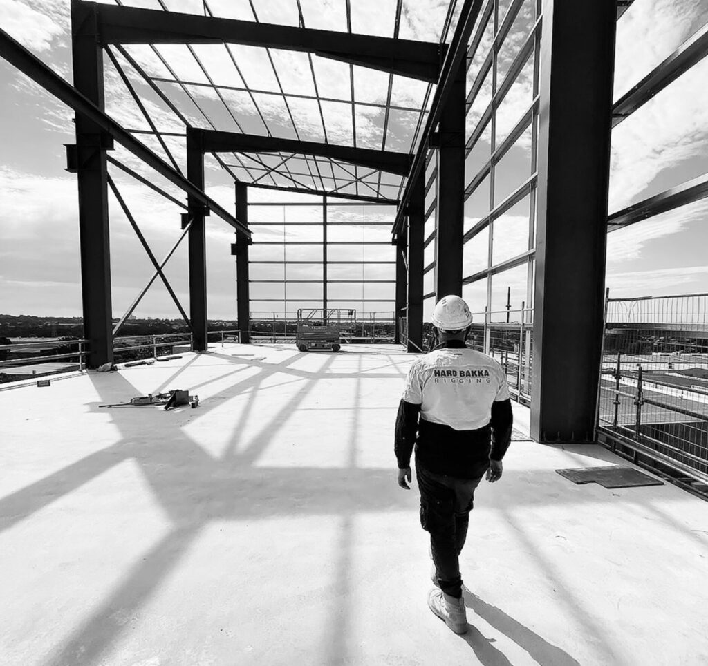 Hard Bakka Rigging worker inspecting an erected structural steel frame